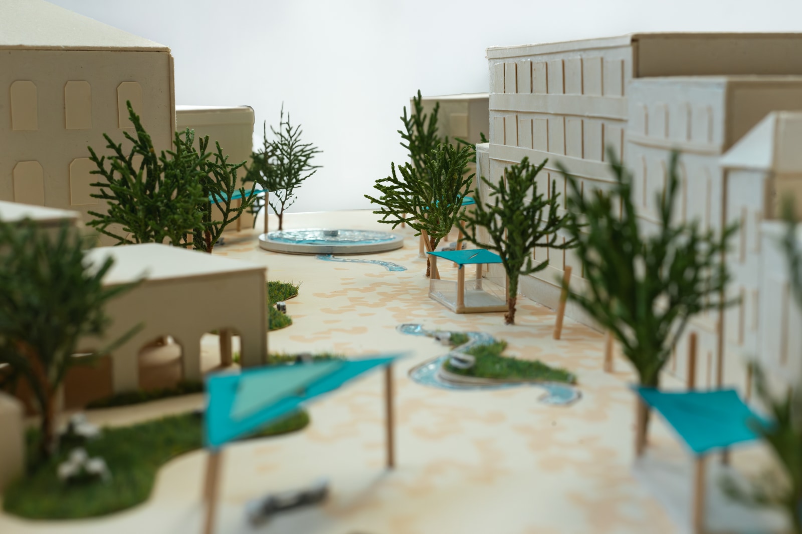 Physical scale model looking along the water route toward the circular fountain.
