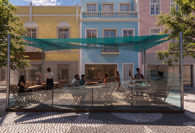 Shaded café seating beneath blue-green fabric canopies.