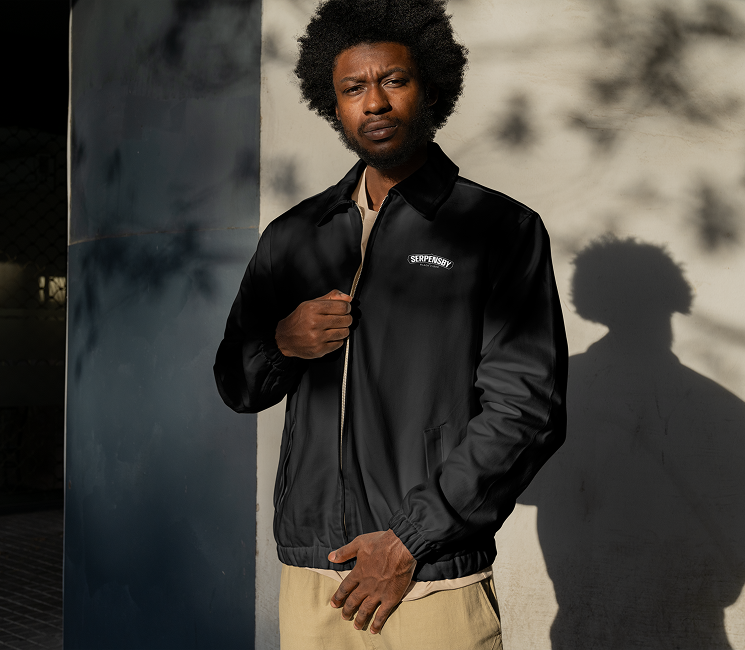 Black jacket with an embroidered SERPENSBY logo.